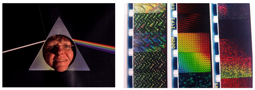 Woman in the center of a prism with rainbow lights shooting out of it.