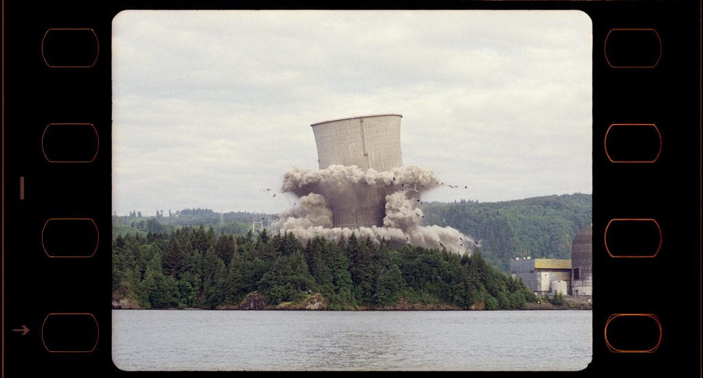 A tower that imploded over a forested area